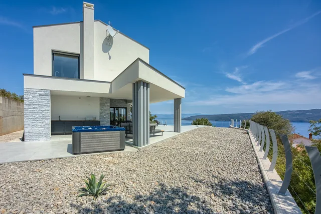 Hot tub beside the terrace and contemporary villa façade