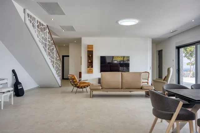 Living room and staircase at Villa Stefanija