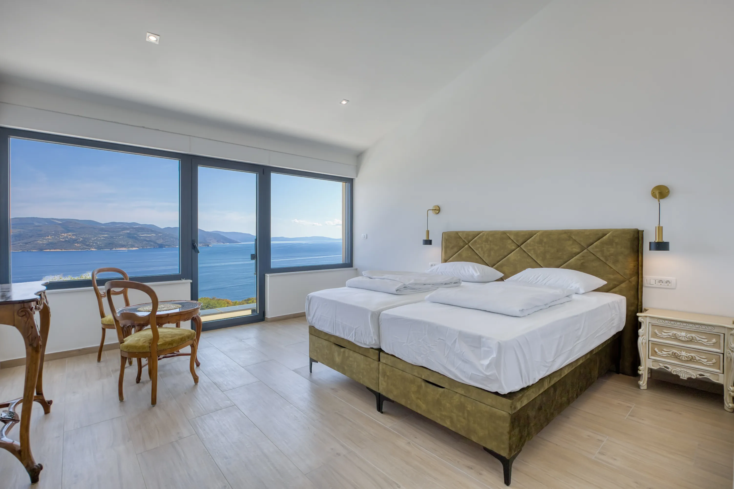 Bright bedroom overlooking the sea